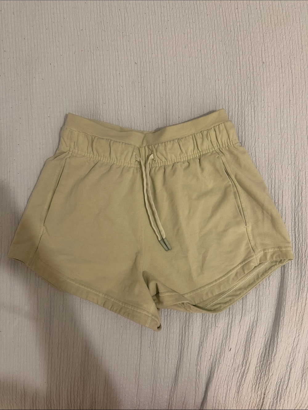 light green Lululemon sweatshorts